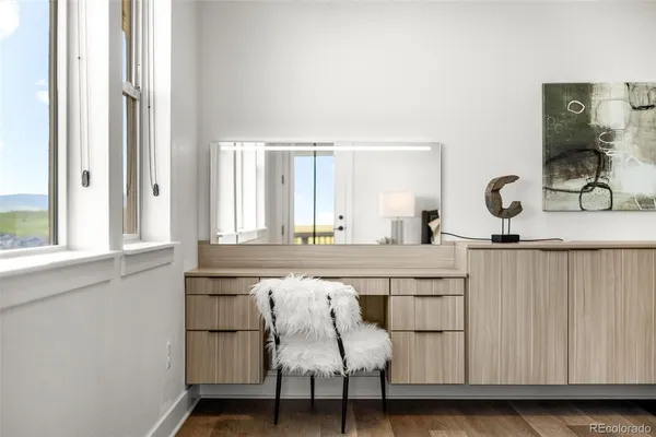 a view of a balcony with wooden floor and city view