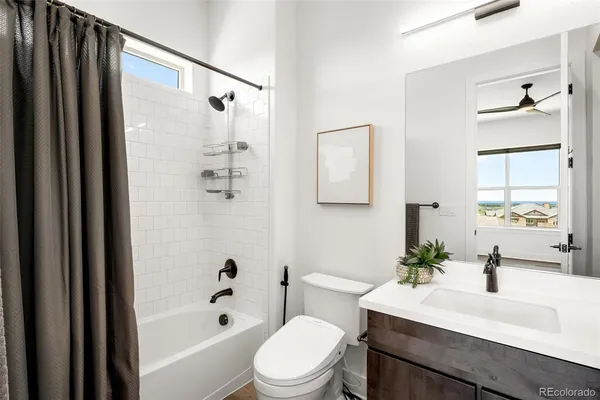 a view of a kitchen with a refrigerator and a microwave