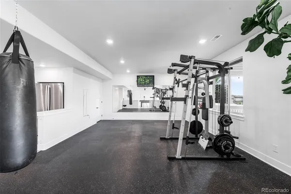 a bathroom with a double vanity sink toilet and shower