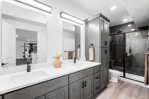 an aerial view of residential houses with outdoor space and ocean view