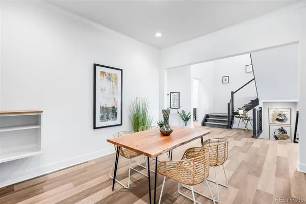 a view of a dining room with furniture and a table