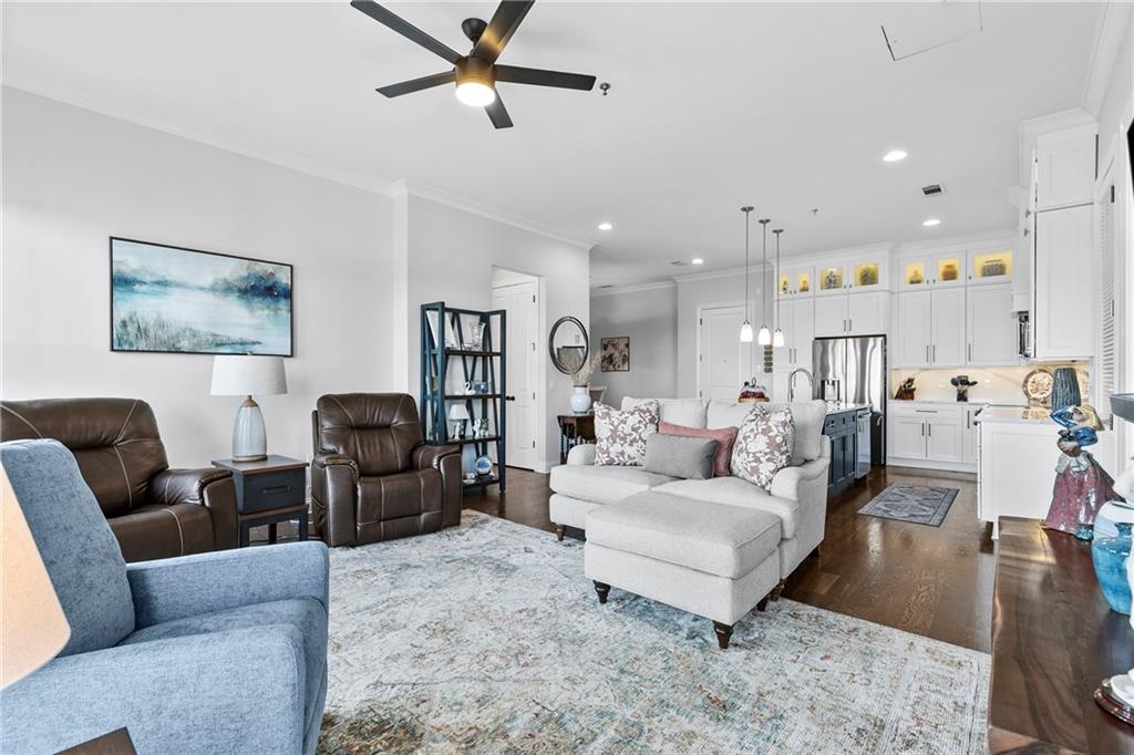 360 Chambers Street, Unit 309 Woodstock, GA 30188 - Photo 13 of 58 a living room with furniture and a view of kitchen