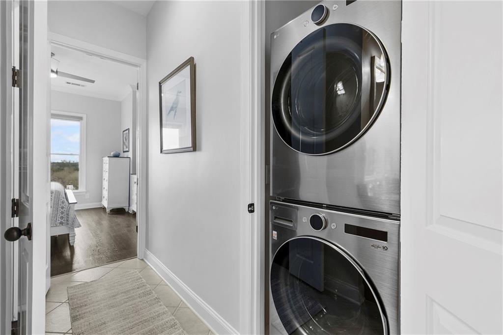 360 Chambers Street, Unit 309 Woodstock, GA 30188 - Photo 24 of 58 a view of a hallway with washer and dryer