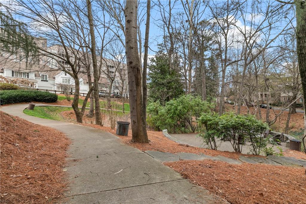 360 Chambers Street, Unit 309 Woodstock, GA 30188 - Photo 36 of 58 a view of a road with a trees