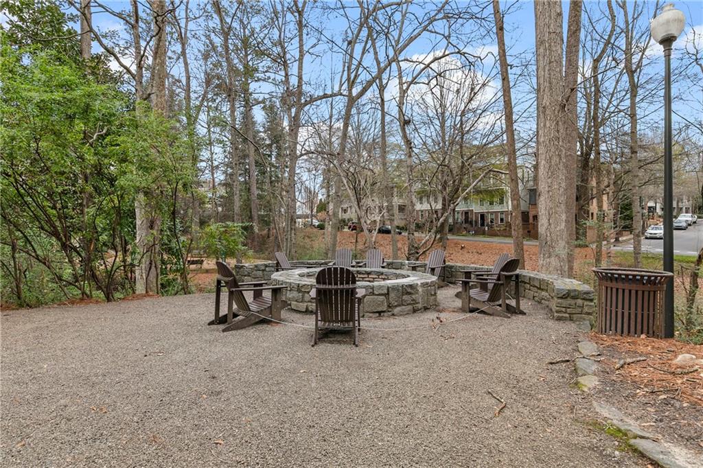 360 Chambers Street, Unit 309 Woodstock, GA 30188 - Photo 36 of 58 a view of a park with bench and trees