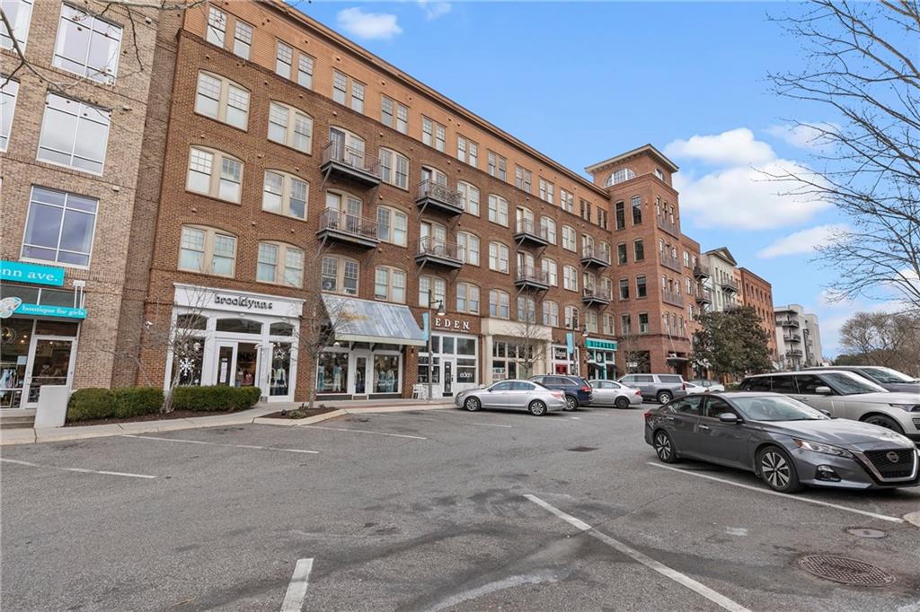 360 Chambers Street, Unit 309 Woodstock, GA 30188 - Photo 40 of 58 a buildings with car parked in front of it