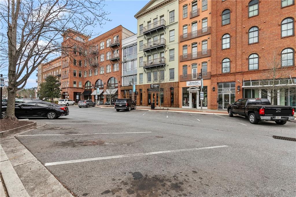 360 Chambers Street, Unit 309 Woodstock, GA 30188 - Photo 41 of 58 a view of a street with cars