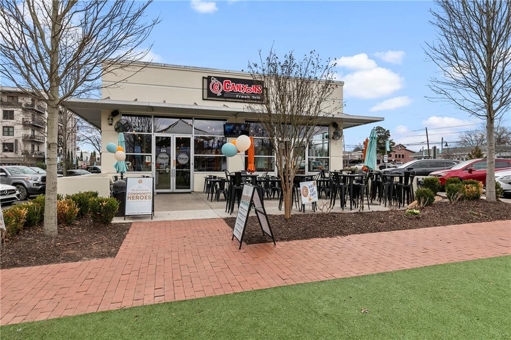 360 Chambers Street, Unit 309 Woodstock, GA 30188 - Photo 43 of 58 a view of outdoor space yard deck patio and outdoor kitchen