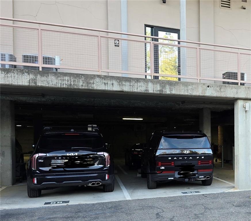 360 Chambers Street, Unit 309 Woodstock, GA 30188 - Photo 58 of 58 a car parked in a parking