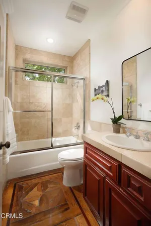 a bedroom with a bed and a fireplace