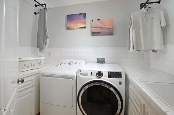 a bathroom with a shower sink and mirror