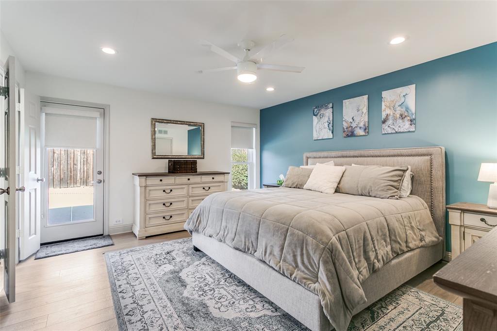 2922 Ridgewood Drive Grapevine, TX 76051 - Photo 15 of 25 a spacious bedroom with a large bed a rug and painting on the wall