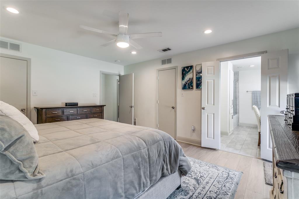 2922 Ridgewood Drive Grapevine, TX 76051 - Photo 16 of 25 a spacious bedroom with a bed and a rug