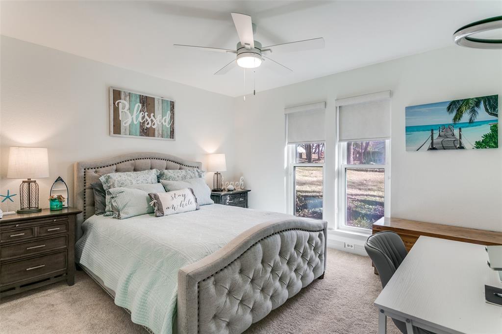 2922 Ridgewood Drive Grapevine, TX 76051 - Photo 19 of 25 a bedroom with a bed and a couch