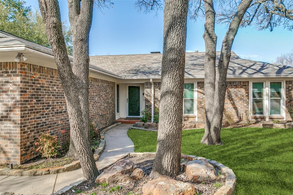 2922 Ridgewood Drive Grapevine, TX 76051 - Photo 3 of 25 a front view of a house with garden