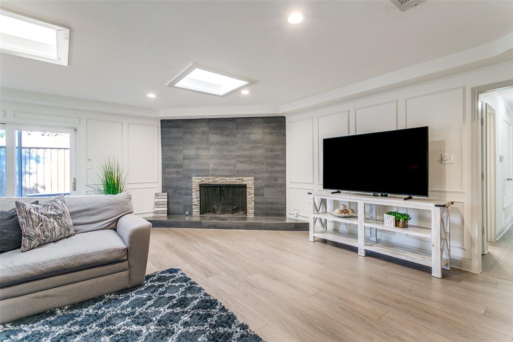 2922 Ridgewood Drive Grapevine, TX 76051 - Photo 4 of 25 a living room with furniture and a flat screen tv