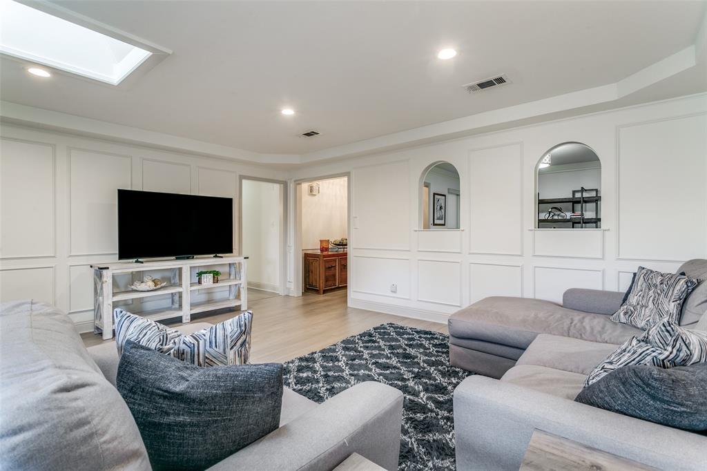 2922 Ridgewood Drive Grapevine, TX 76051 - Photo 5 of 25 a living room with furniture and a flat screen tv