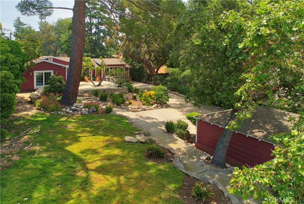 a view of a chairs in backyard of the house