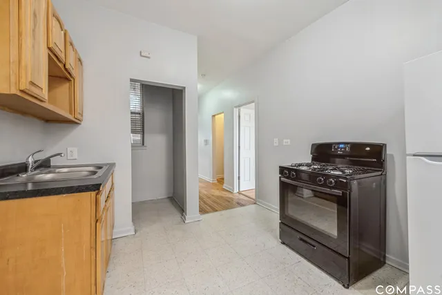 a kitchen with a stove and a microwave