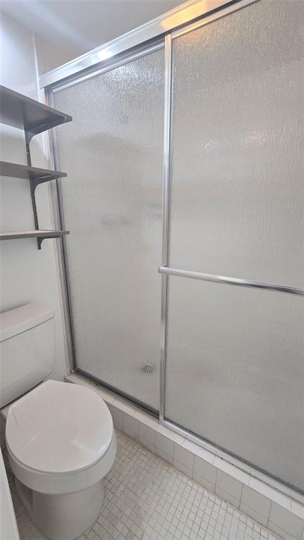 8401 West Sample Road, Unit 48 Coral Springs, FL 33065 - Photo 18 of 26 a bathroom with a toilet and a shower