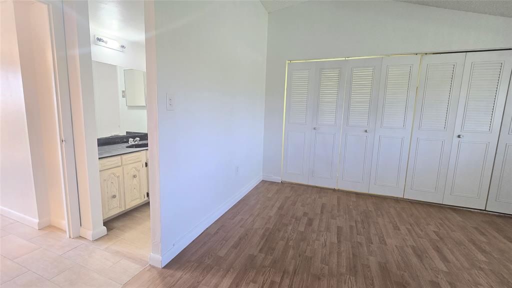 8401 West Sample Road, Unit 48 Coral Springs, FL 33065 - Photo 19 of 26 a view of hallway with wooden floor