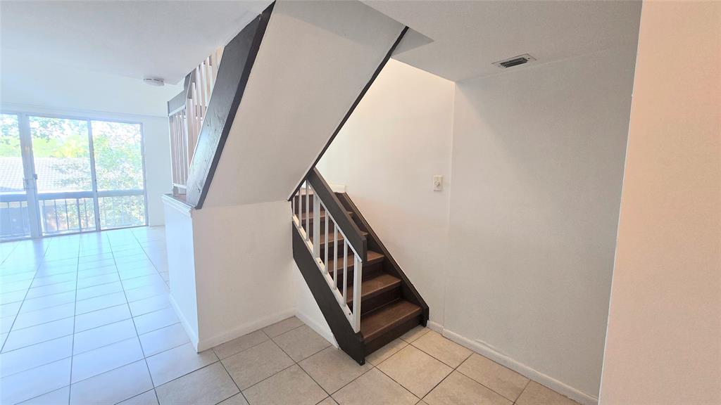 8401 West Sample Road, Unit 48 Coral Springs, FL 33065 - Photo 7 of 26 a view of an entryway with staircase