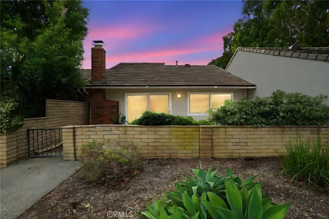 a view of a lake with a house in the background
