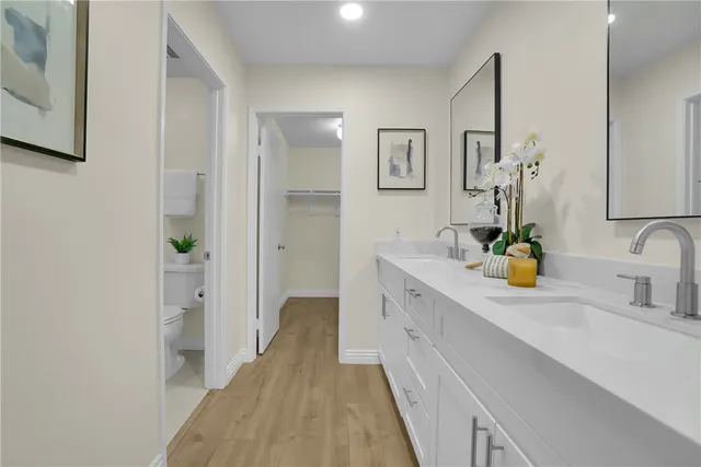 a bathroom with a shower a sink and a mirror