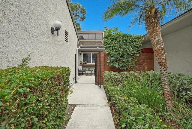 a backyard of a house with outdoor seating