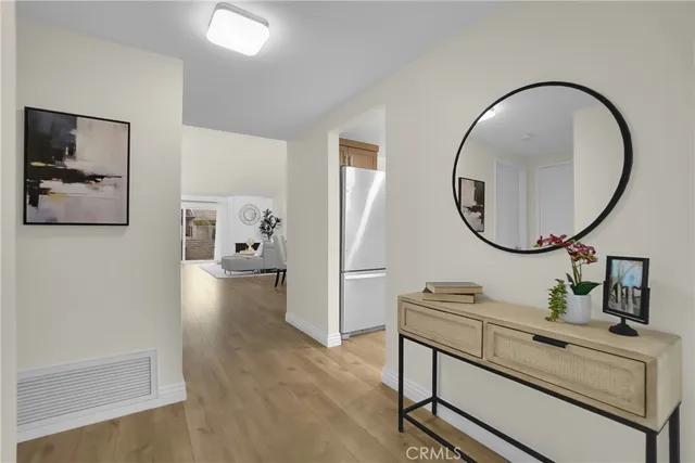 a living room with furniture potted plant and a window