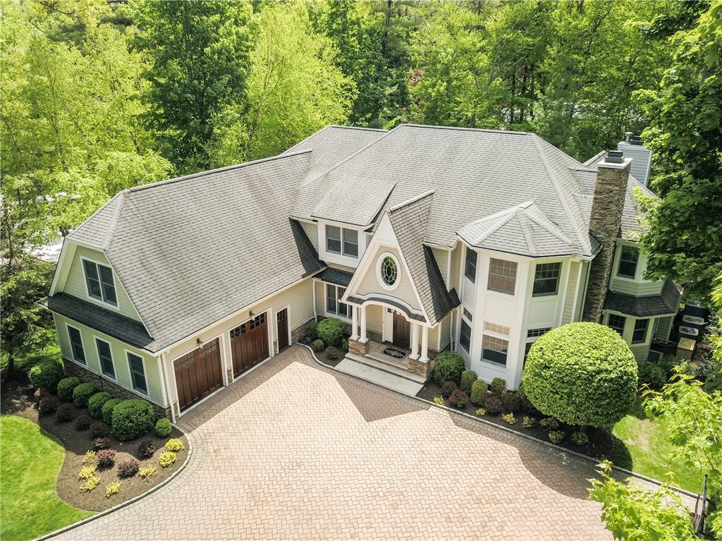 52 Lincoln Avenue Rye Brook, NY 10577 - Photo 1 of 1 a aerial view of a house with a yard and potted plants