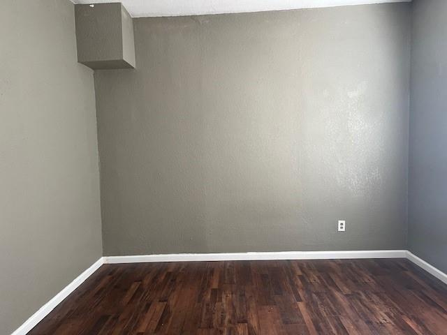 714 North Commerce Street Gainesville, TX 76240 - Photo 15 of 19 a view of an empty room with wooden floor
