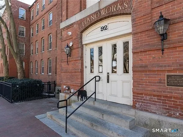 a view of brick building with many windows