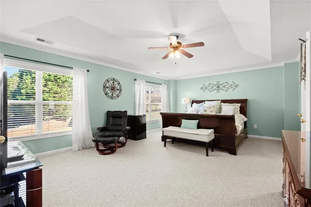 a bedroom with a bed and with furniture