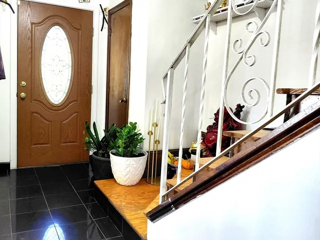 a view of a entryway door front of a house