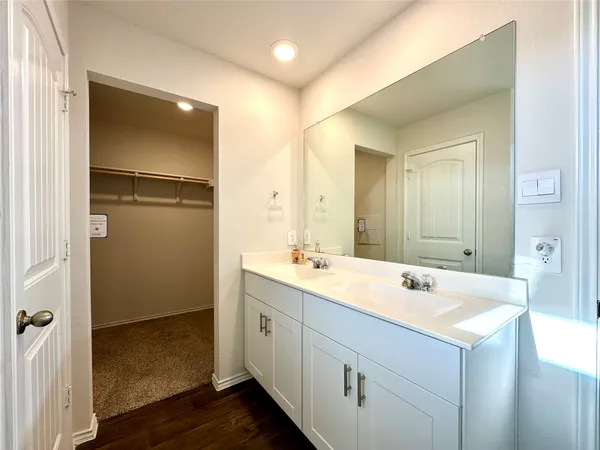 a bathroom with a sink and mirror