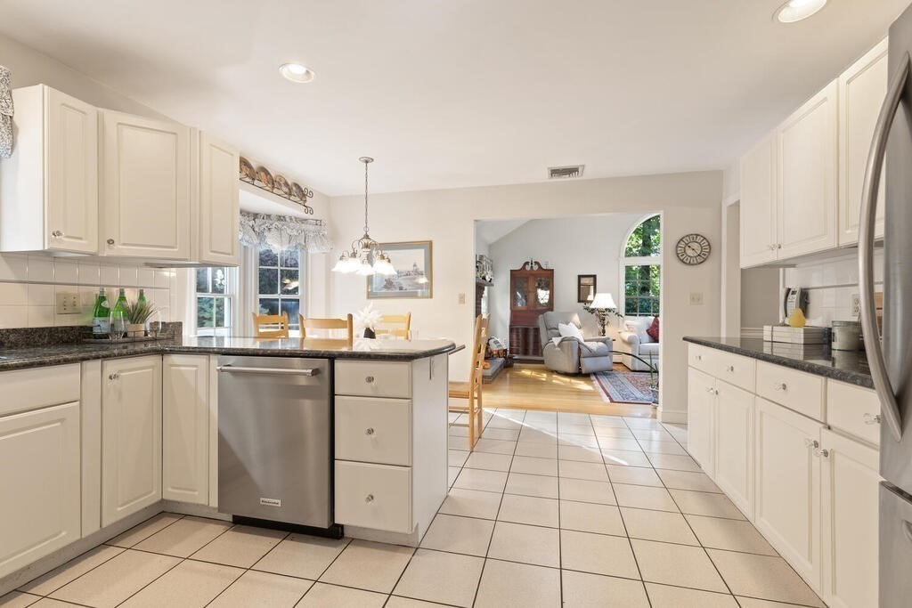 6 Wickham Road Winchester, MA 01890 - Photo 11 of 37 a large white kitchen with cabinets and a window