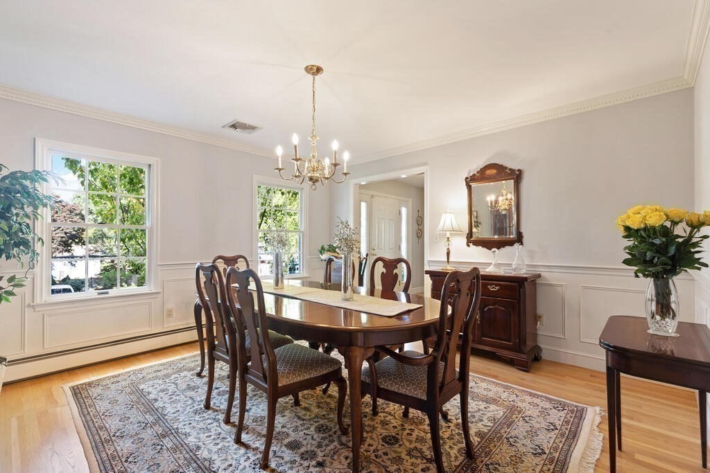 6 Wickham Road Winchester, MA 01890 - Photo 17 of 37 a view of a dining room with furniture window and wooden floor