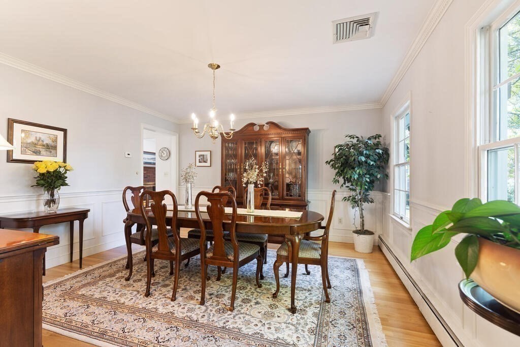6 Wickham Road Winchester, MA 01890 - Photo 18 of 37 a view of a dining room with furniture window and wooden floor