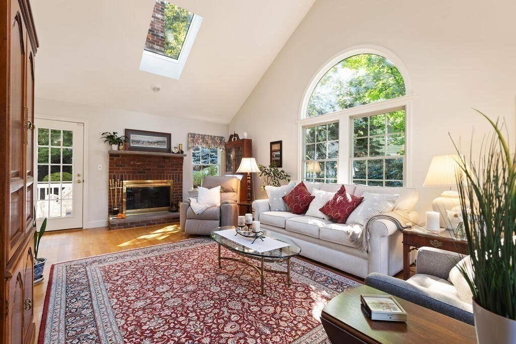 6 Wickham Road Winchester, MA 01890 - Photo 2 of 37 a living room with furniture a fireplace and a large window