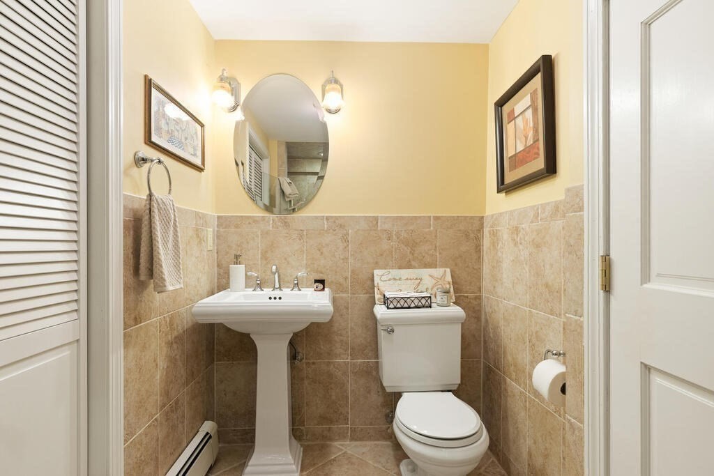 6 Wickham Road Winchester, MA 01890 - Photo 28 of 37 a bathroom with a sink mirror and toilet