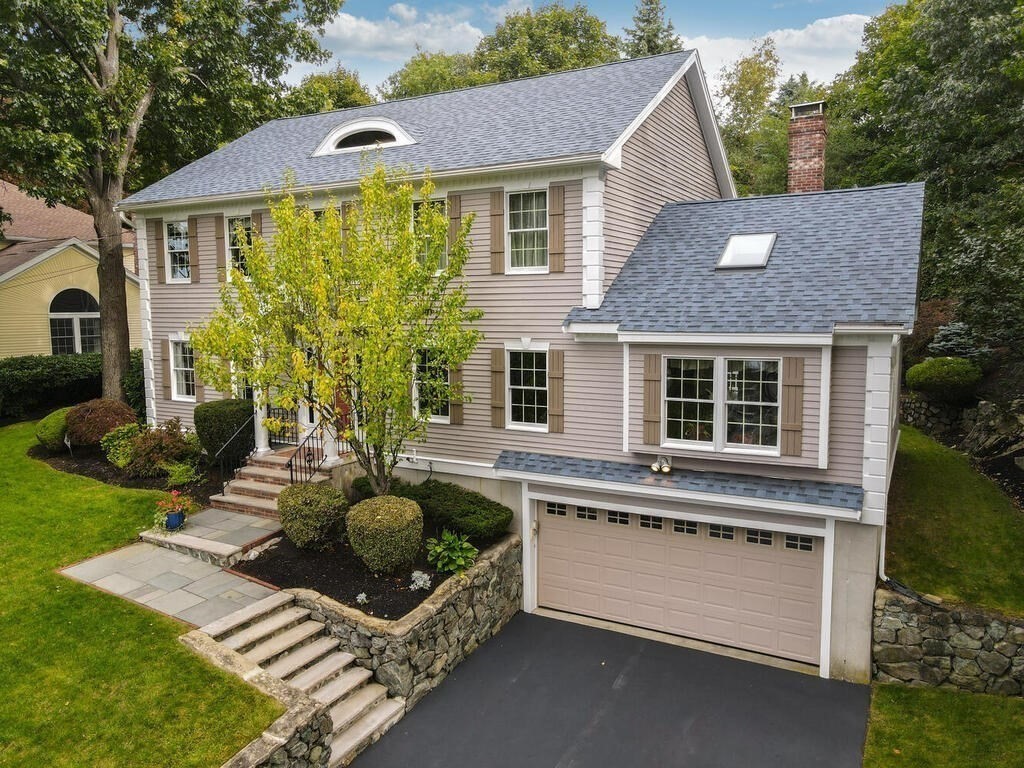6 Wickham Road Winchester, MA 01890 - Photo 32 of 37 a view of a house with backyard and sitting area