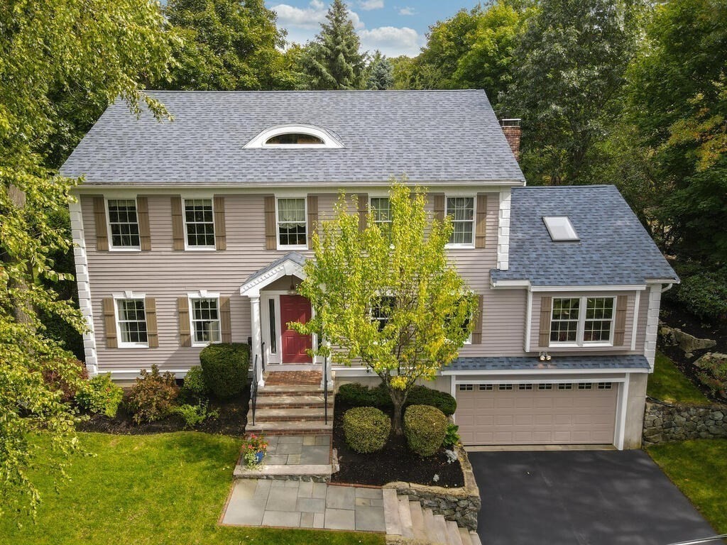 6 Wickham Road Winchester, MA 01890 - Photo 33 of 37 a front view of a house with a yard and trees