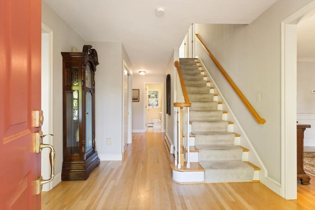 6 Wickham Road Winchester, MA 01890 - Photo 6 of 37 a view of a hallway with wooden floor and entryway