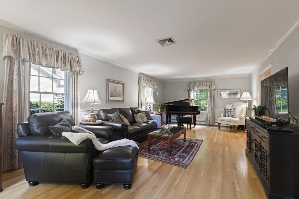 6 Wickham Road Winchester, MA 01890 - Photo 9 of 37 a living room with furniture and a flat screen tv