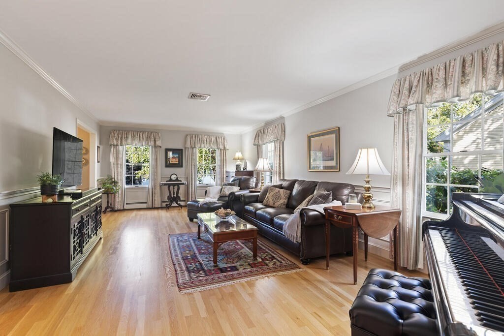 6 Wickham Road Winchester, MA 01890 - Photo 10 of 37 a living room with furniture and a flat screen tv