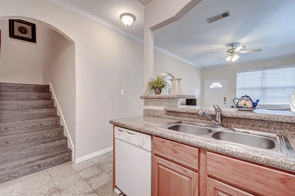 a kitchen with a sink and a window