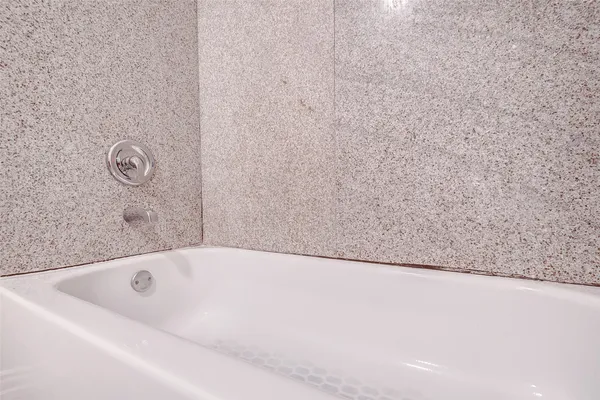 a bathroom with a bathtub