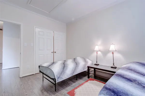 a bed room with a bed and a night stand