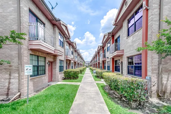 a view of a building with a yard